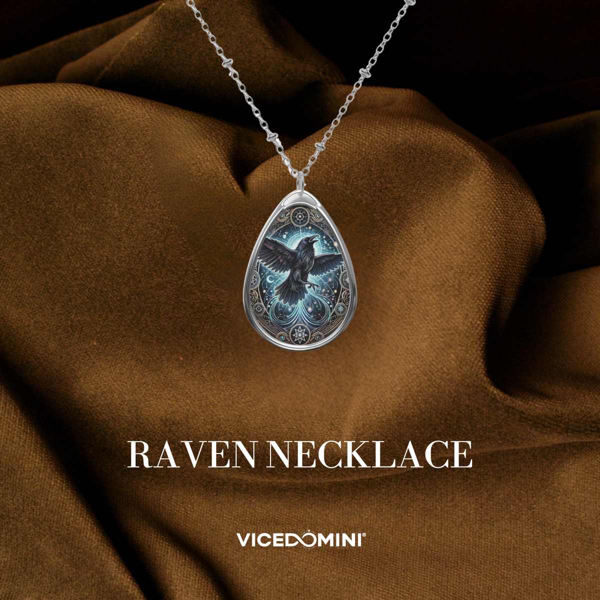 A teardrop-shaped pendant necklace featuring an intricately designed red panda surrounded by glowing celestial patterns in red, blue, and gold tones. The necklace is displayed against a rich brown fabric backdrop with "Red Panda Necklace" and "VICEDOMINI" text overlay.