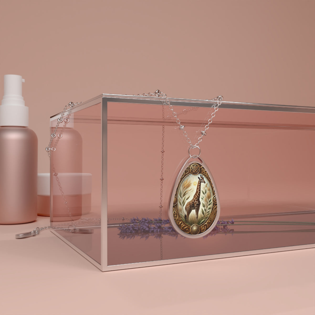 A giraffe spirit animal necklace displayed on a pink glass box with lavender accents and soft peach background. The pendant features intricate details of a giraffe surrounded by golden and earthy tones.