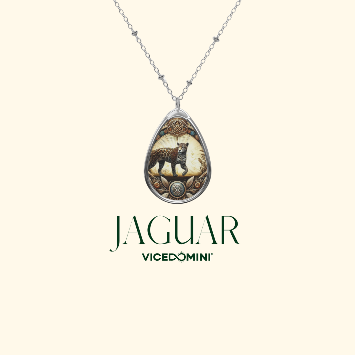 A teardrop-shaped pendant necklace featuring an illustrated leopard on a silver-toned chain, displayed against a light cream background with the brand name 'JAGUAR Vicedomini' printed below.