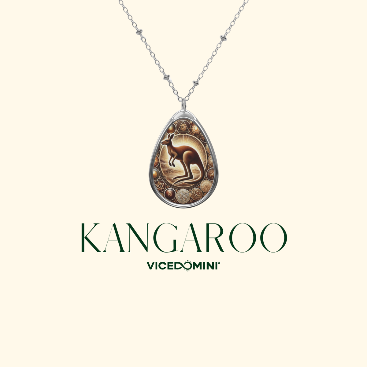 A silver teardrop pendant necklace featuring an Australian kangaroo design with gold-toned circular accents, shown on a light cream background with the brand name 'KANGAROO VICEDOMINI' below.