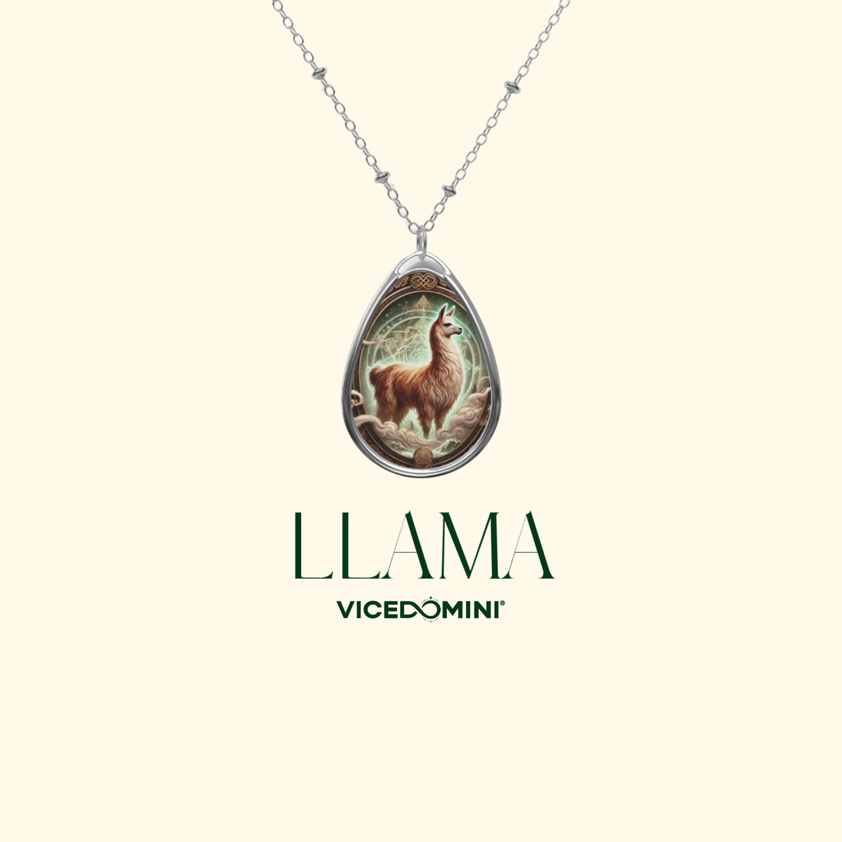 Silver teardrop pendant necklace featuring an illustrated llama in a forest, with the brand name 'LLAMA VICEDOMINI' printed below on a light cream background.
