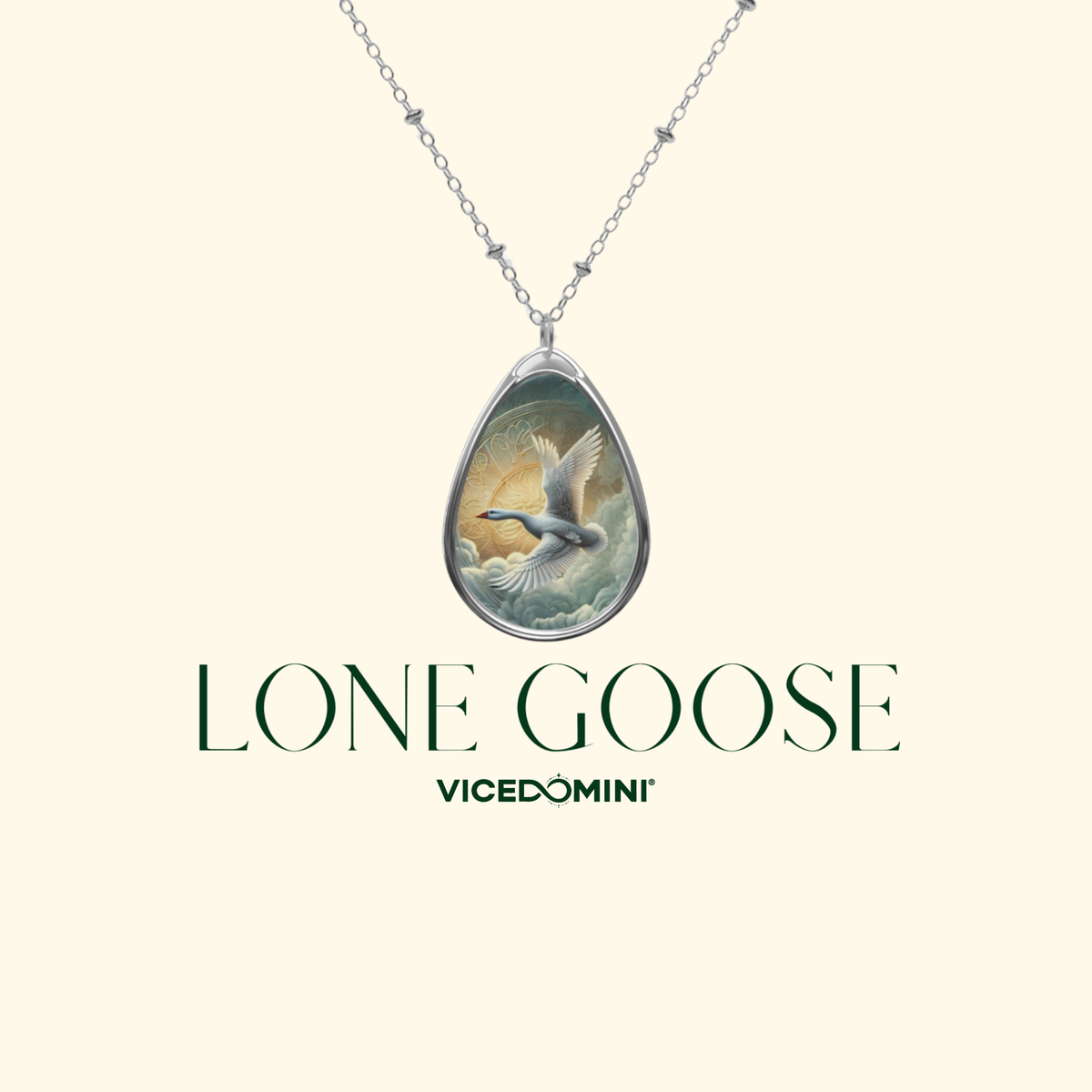 A silver teardrop pendant necklace featuring a detailed illustration of a flying goose, displayed on a cream background with the text 'LONE GOOSE' and 'VICEDOMINI' underneath.