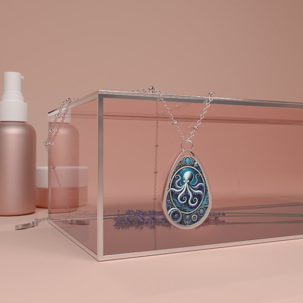The octopus necklace is draped over a transparent glass box, surrounded by soft, pastel-colored beauty products and lavender sprigs. The pendant glows with deep blue and purple tones, with detailed metallic patterns enhancing its design.