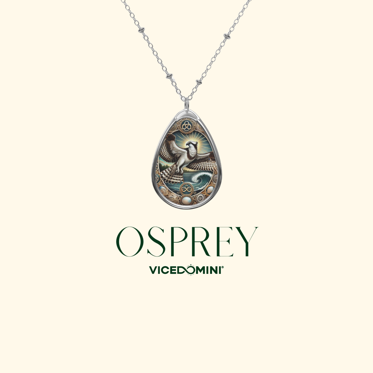 Teardrop-shaped silver pendant necklace featuring an ornate bird and wave design with teal, gold, and cream details, suspended from a delicate silver chain on a light cream background. The brand name 'OSPREY' and 'VICEDOMINI' are printed below the pendant.