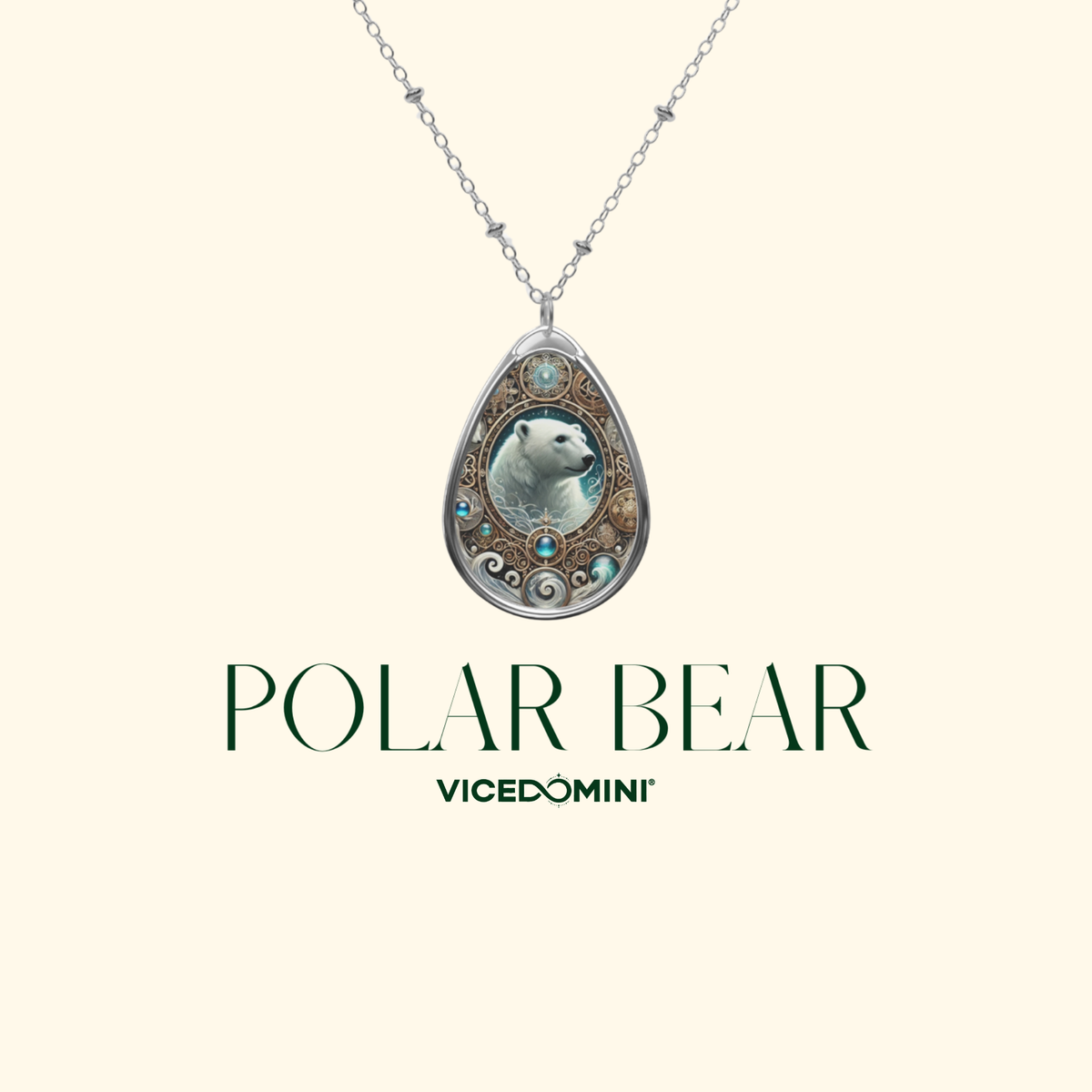 A Vicedomini necklace featuring a teardrop-shaped pendant with an illustrated polar bear surrounded by ornate silver filigree and blue-green accents, suspended from a silver chain on a light cream background with the text 'POLAR BEAR' and 'VICEDOMINI' below.
