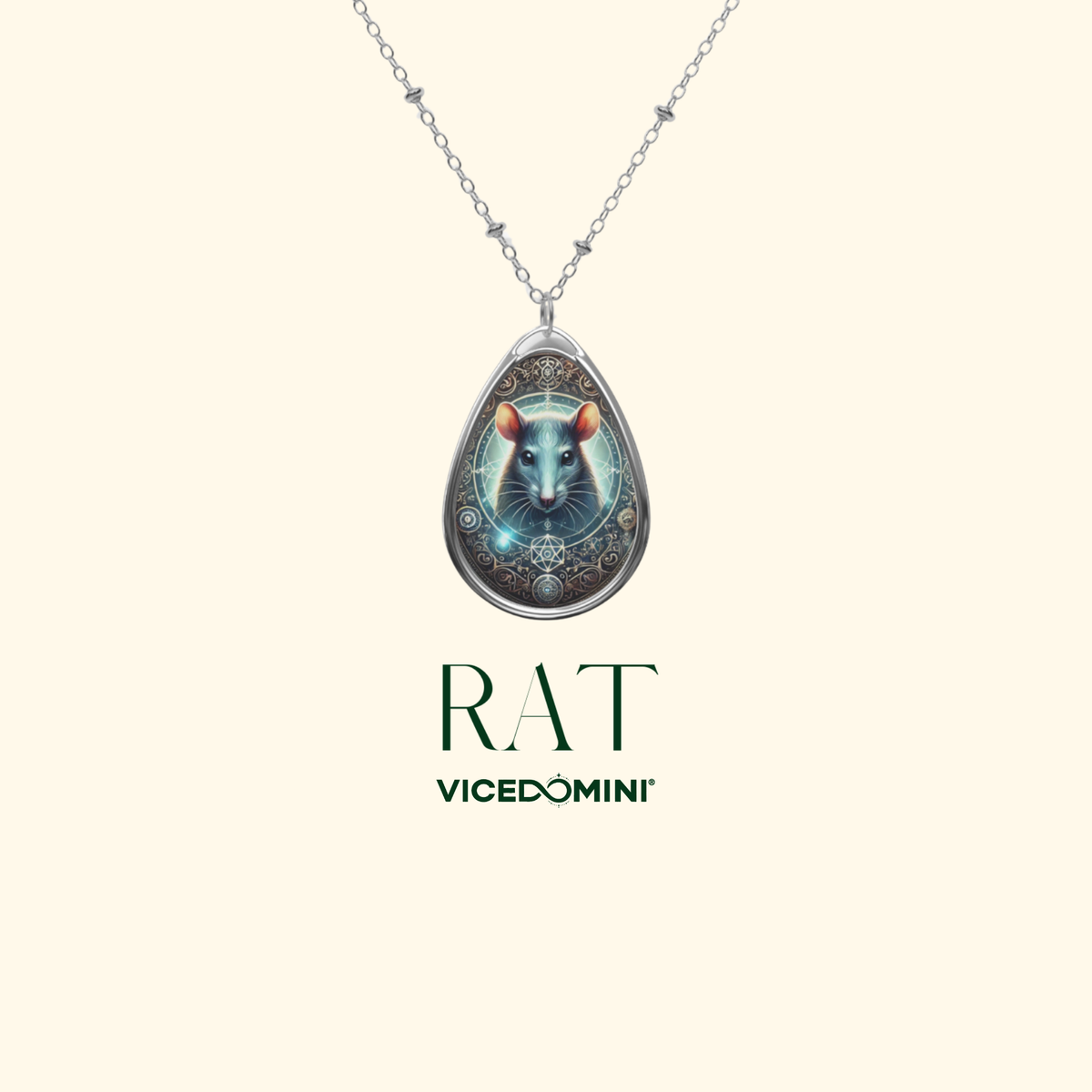 A close-up of a silver chain necklace with a teardrop-shaped pendant showcasing a luminous rat illustration. The pendant's design includes mystical symbols and glowing accents. The background is a soft, cream color with the words "RAT" and "VICEDOMINI" in an elegant serif font.