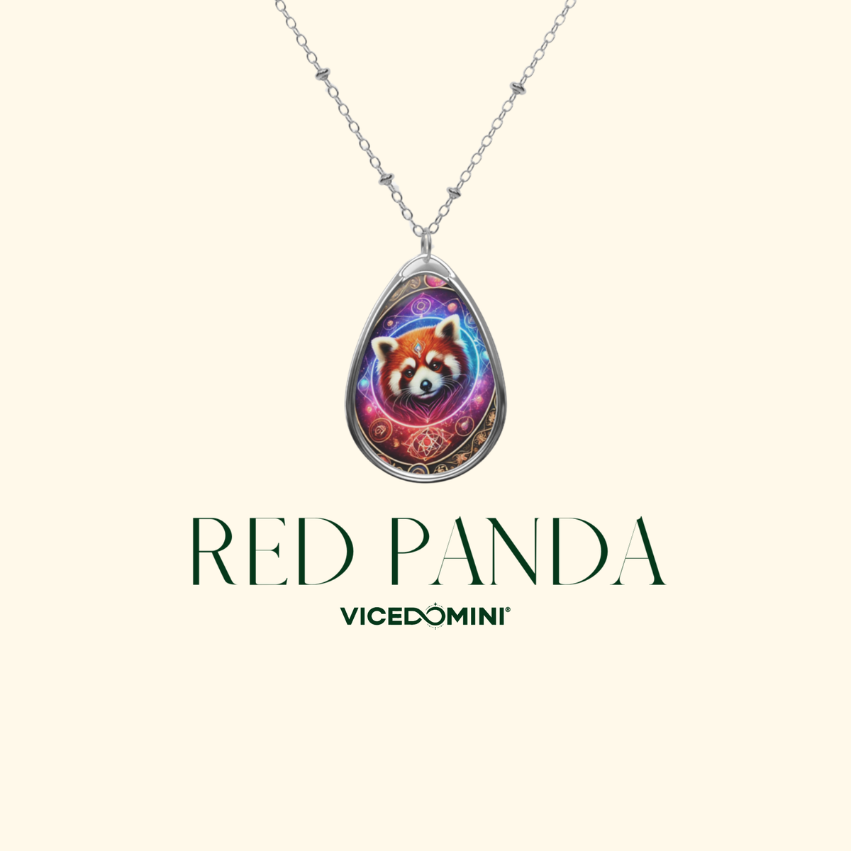 A close-up of a silver teardrop pendant necklace showcasing a vibrant red panda illustration with celestial elements. The text "RED PANDA" and "VICEDOMINI" is elegantly displayed on a soft cream-colored background.