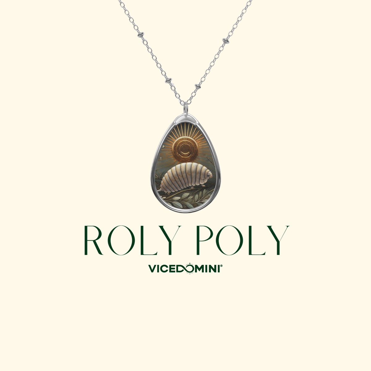 A silver teardrop pendant necklace featuring a detailed illustration of a nautilus shell and sunburst, displayed on a cream background with the text 'ROLY POLY' and 'VICEDOMINI'.