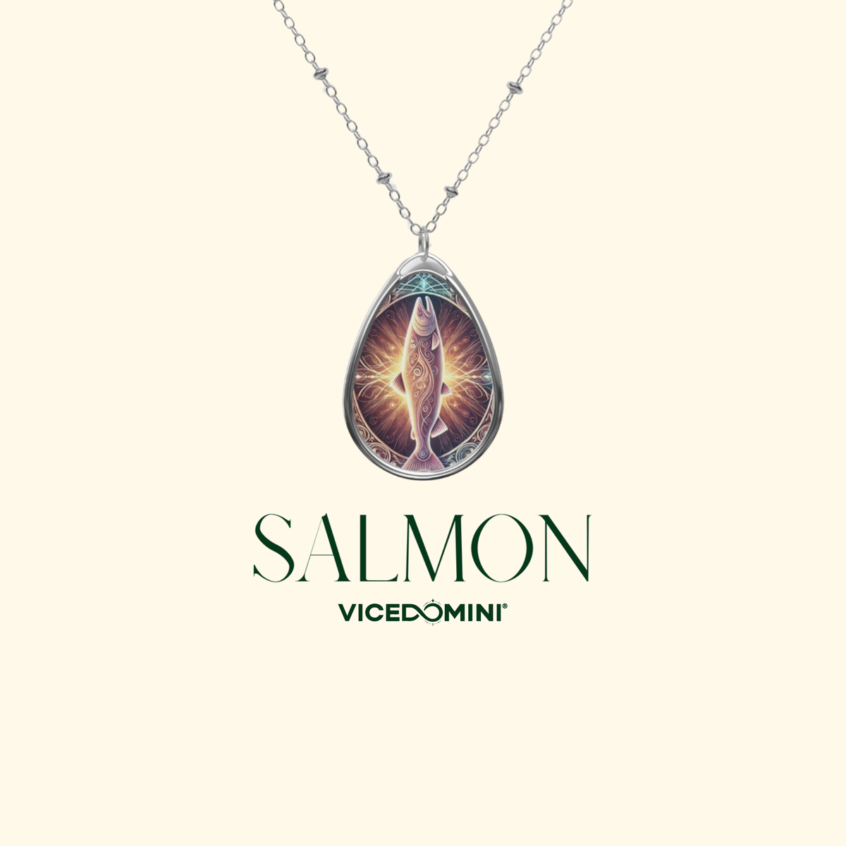 A close-up of the salmon pendant necklace, centered on a minimalist cream-colored background. The text "SALMON" and "VICEDOMINI" is elegantly written beneath.