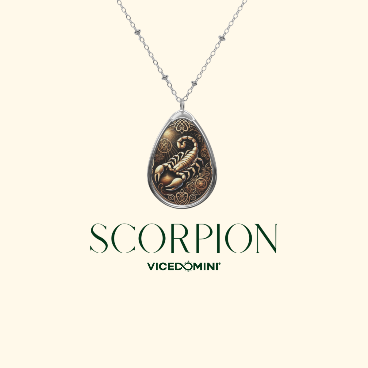 A silver-toned teardrop pendant necklace featuring an embossed scorpion design with gold and bronze detailing, shown against a light cream background with the text 'SCORPION' and 'VICEDOMINI' below.