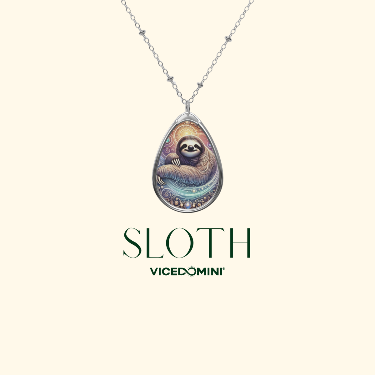 A silver teardrop pendant necklace featuring a colorful illustration of a sloth, shown against a light cream background with the text 'SLOTH' and 'VICEDOMINI' below.