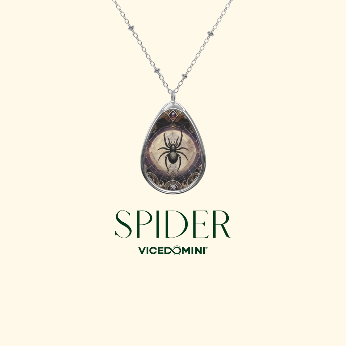 A silver teardrop pendant necklace featuring a spider design on a beige background with dark brown details, shown on a cream background with the brand name 'VICEDOMINI' and the word 'SPIDER' below.