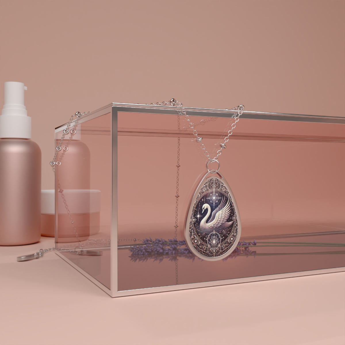 The swan pendant necklace elegantly draped over a transparent glass jewelry box, surrounded by soft, pink-toned skincare bottles and dried lavender. The pendant features an ornate white swan with celestial detailing in an elegant, mystical design.