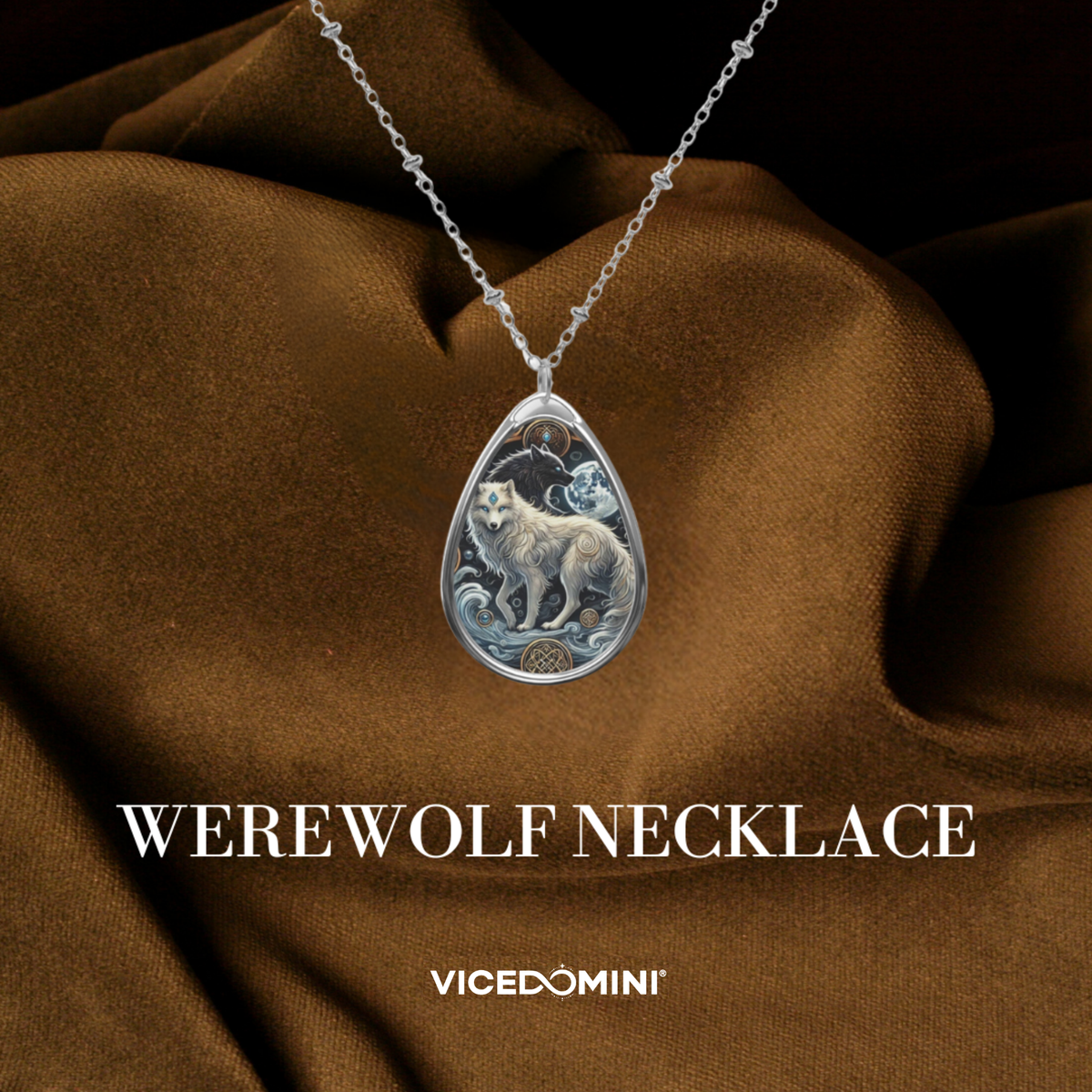 A teardrop-shaped silver pendant necklace featuring an illustrated werewolf design, draped over brown satin fabric with the text 'WEREWOLF NECKLACE' and 'VICEDOMINI' below.