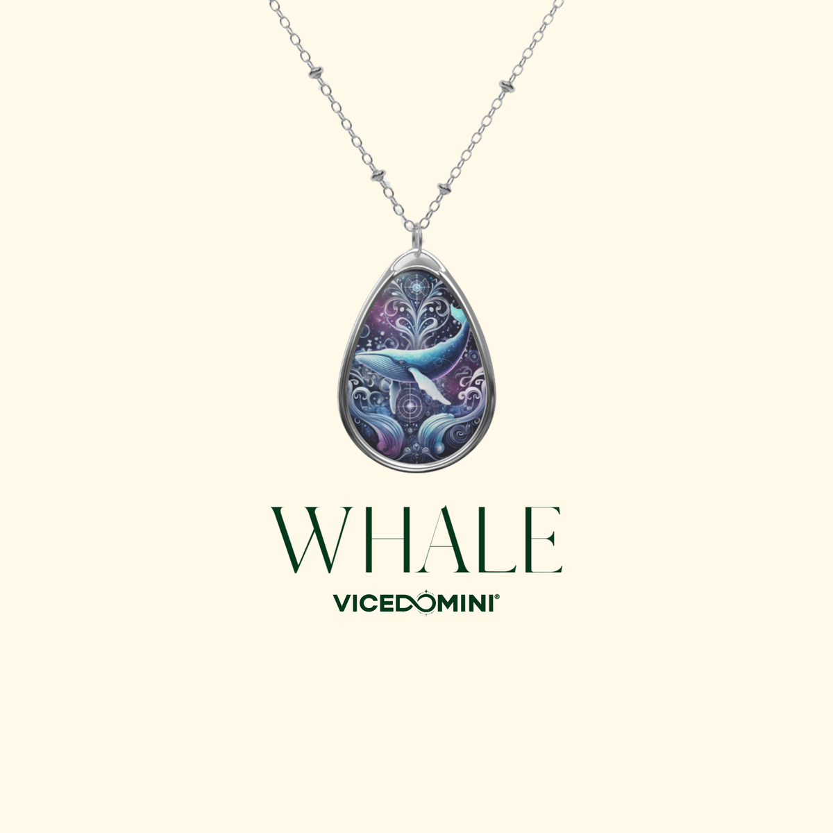A silver teardrop pendant necklace featuring a detailed mermaid illustration in shades of blue, purple, and white, suspended from a delicate silver chain. The pendant is displayed against a light cream background with the brand name 'VICEDOMINI' and the word 'WHALE' printed below.