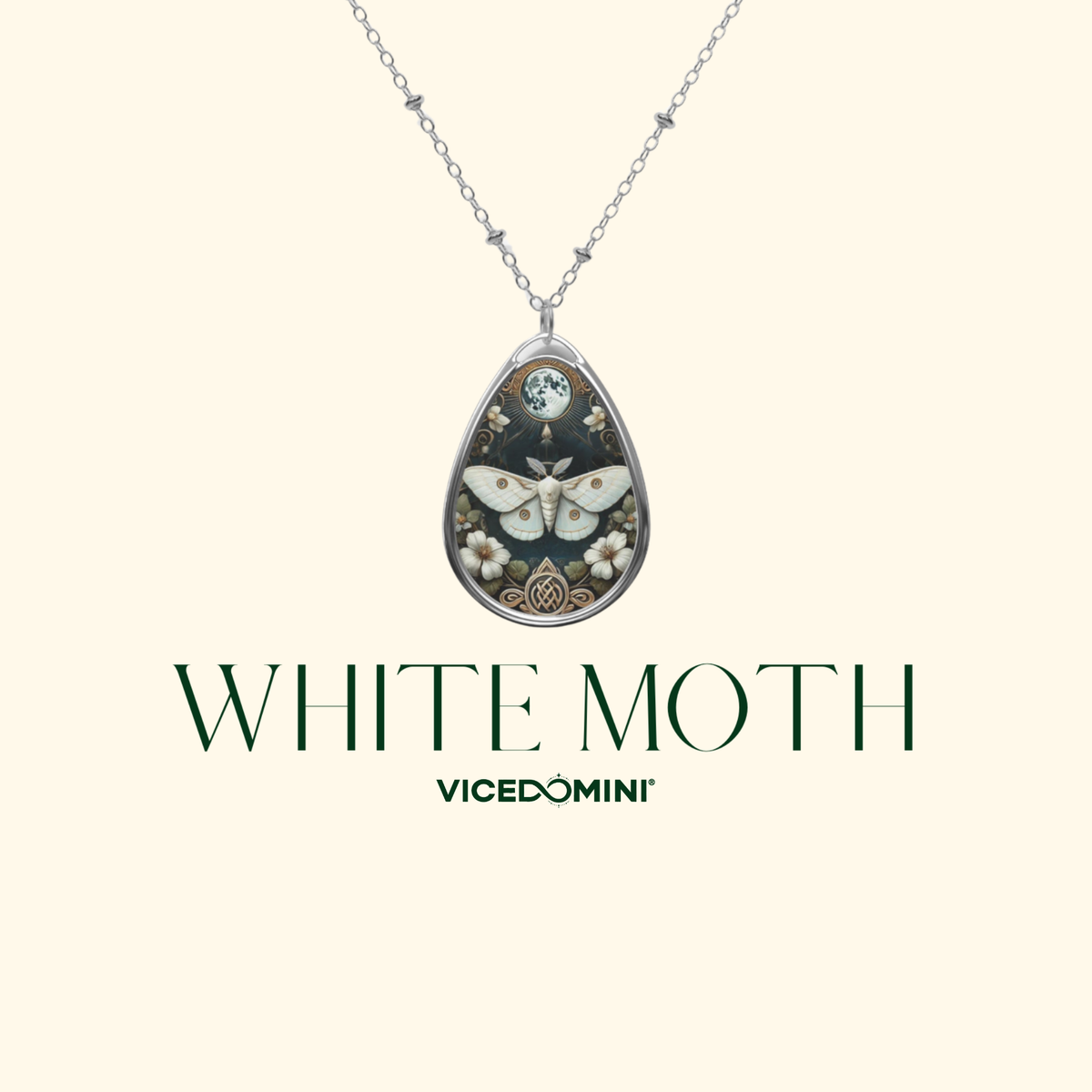 A teardrop-shaped pendant necklace featuring a detailed white moth illustration on a dark background, suspended from a silver chain. The text 'WHITE MOTH' and the brand 'VICEDOMINI' are displayed below on a light cream background.