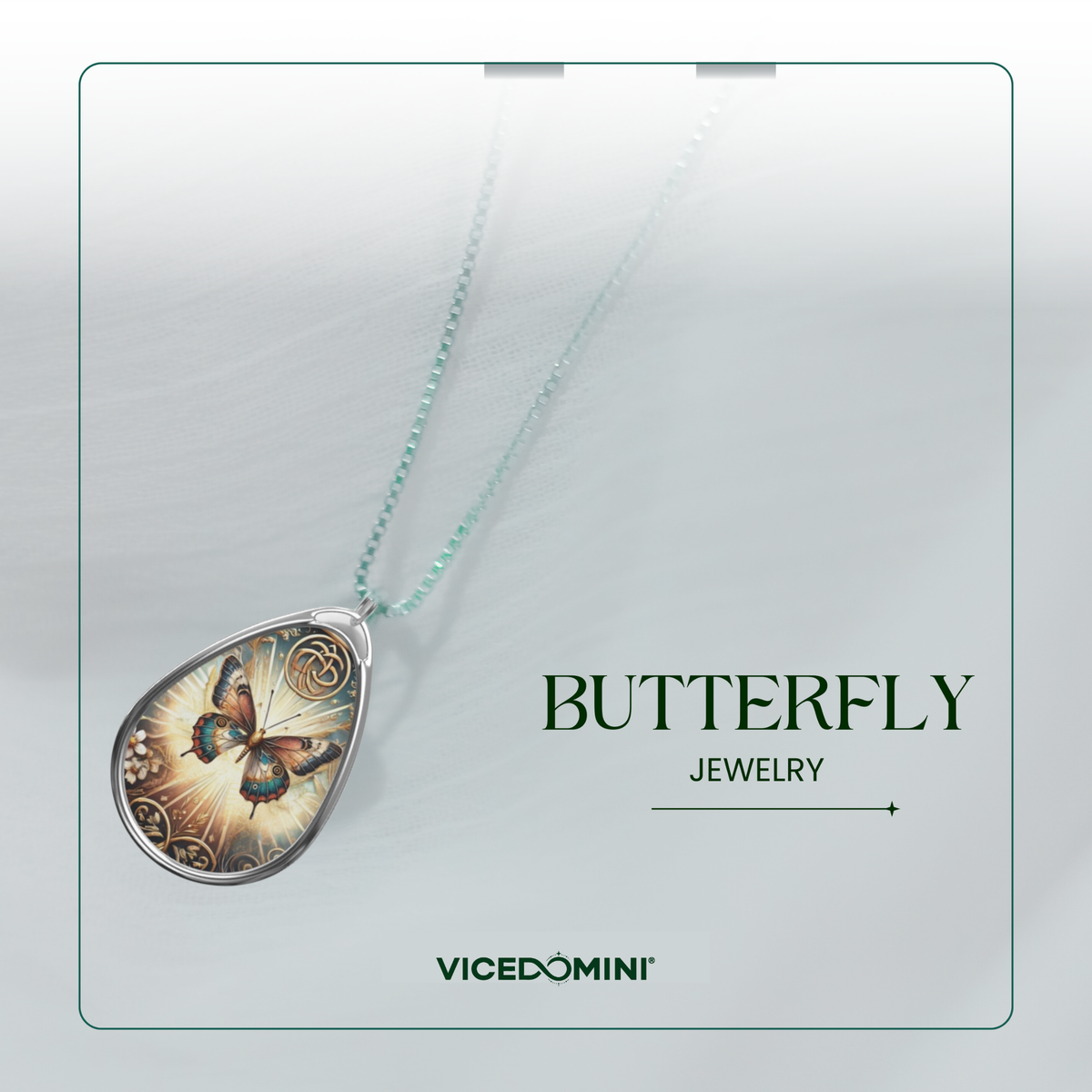 A butterfly pendant necklace displayed on a light gray card with the text 'BUTTERFLY JEWELRY' and the brand name 'VICEDOMINI'. The pendant features a detailed butterfly design with gold, brown, and blue tones, suspended from a delicate mint green chain.