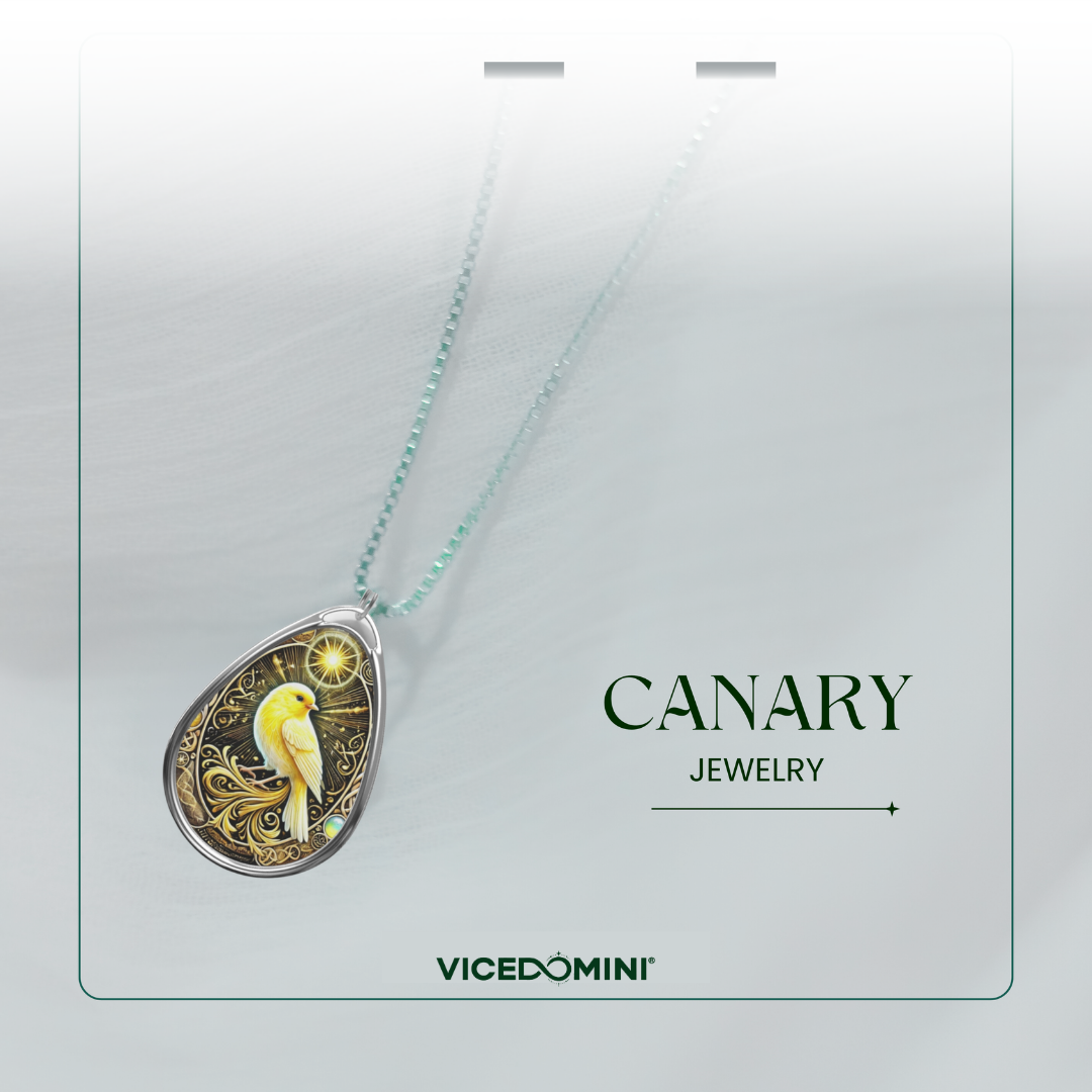 A Vicedomini Canary Jewelry pendant necklace displayed on a light gray card. The pendant features a detailed illustration of a yellow-and-white canary bird on a gold background, suspended from a delicate mint-green chain.