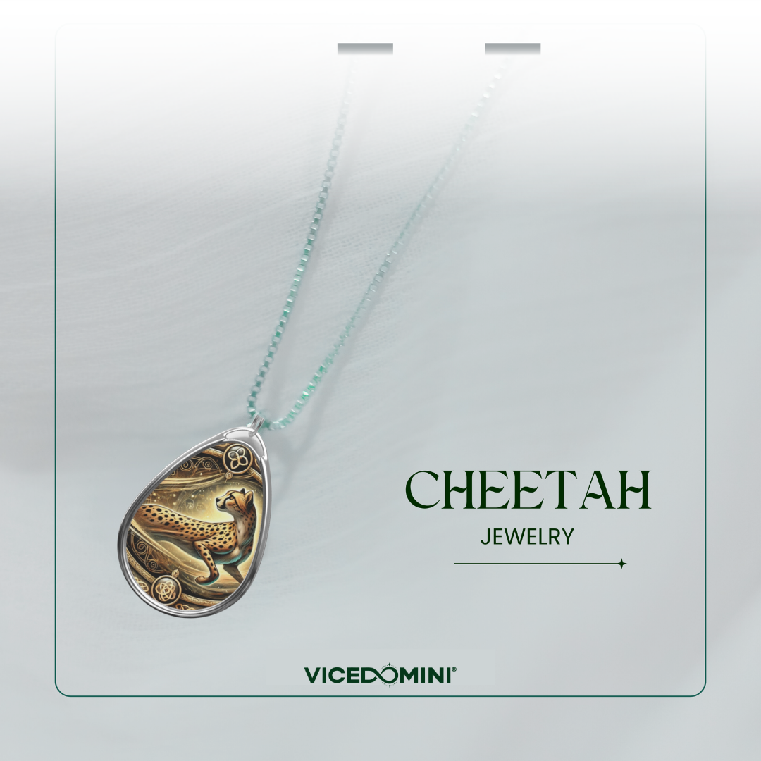 A teardrop-shaped pendant necklace from Vicedomini featuring an intricate gold and silver cheetah illustration, suspended from a light mint green chain. The necklace is presented on a white display card with the text 'CHEETAH JEWELRY' and the Vicedomini brand name.