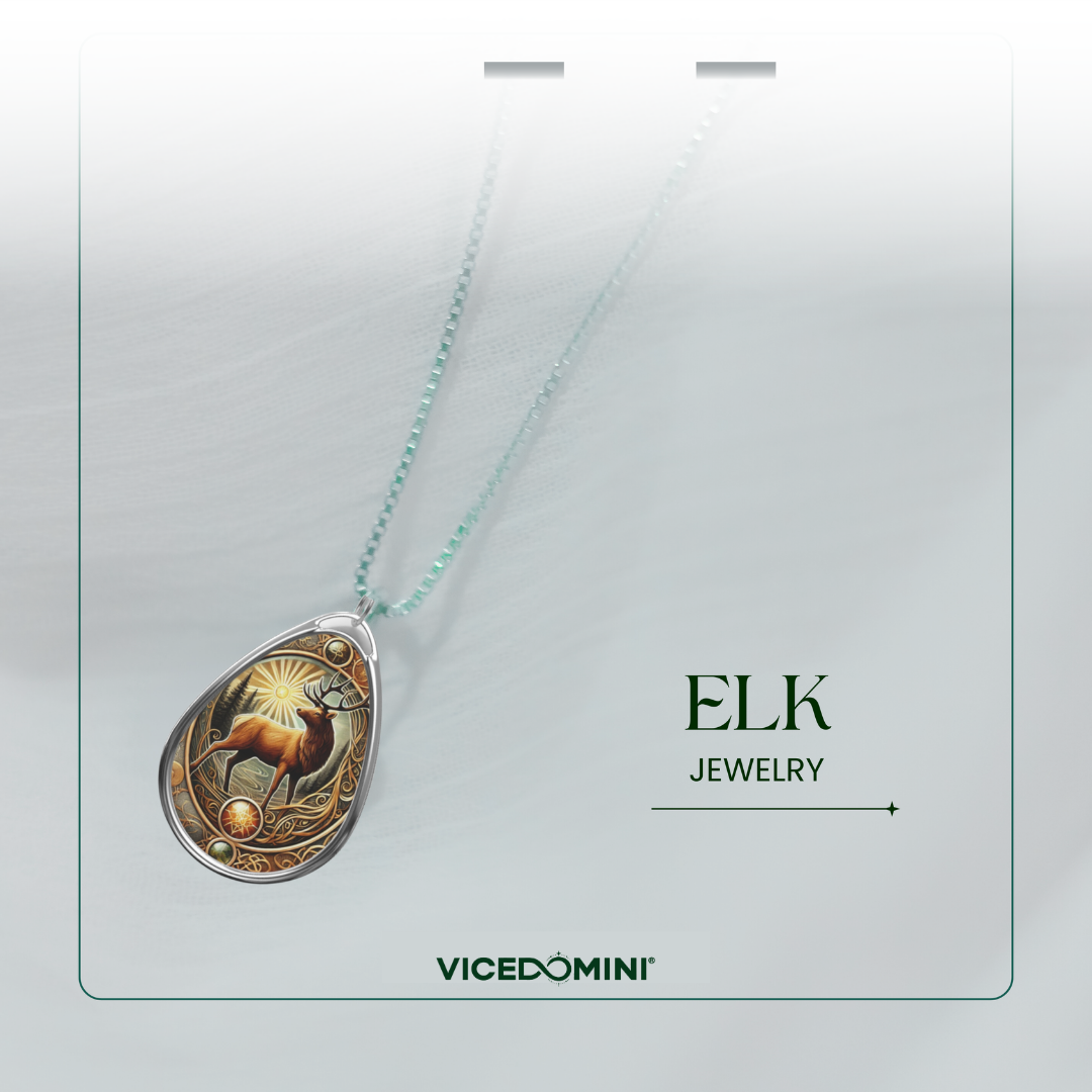 A teardrop-shaped pendant necklace featuring an engraved elk design with a light blue chain, displayed on a white card labeled 'ELK JEWELRY' and 'VICEDOMINI'.