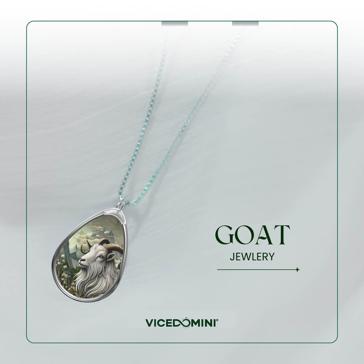 A teardrop-shaped pendant necklace featuring a detailed illustration of a goat on a silver-toned chain, presented on a light gray background with the text 'GOAT JEWLERY' and the brand 'VICEDOMINI'.