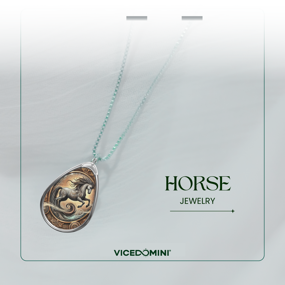 A Vicedomini Horse Jewelry pendant necklace featuring a detailed bronze and gold horse design inside a silver teardrop pendant, suspended from a light green bead chain on a white display card.