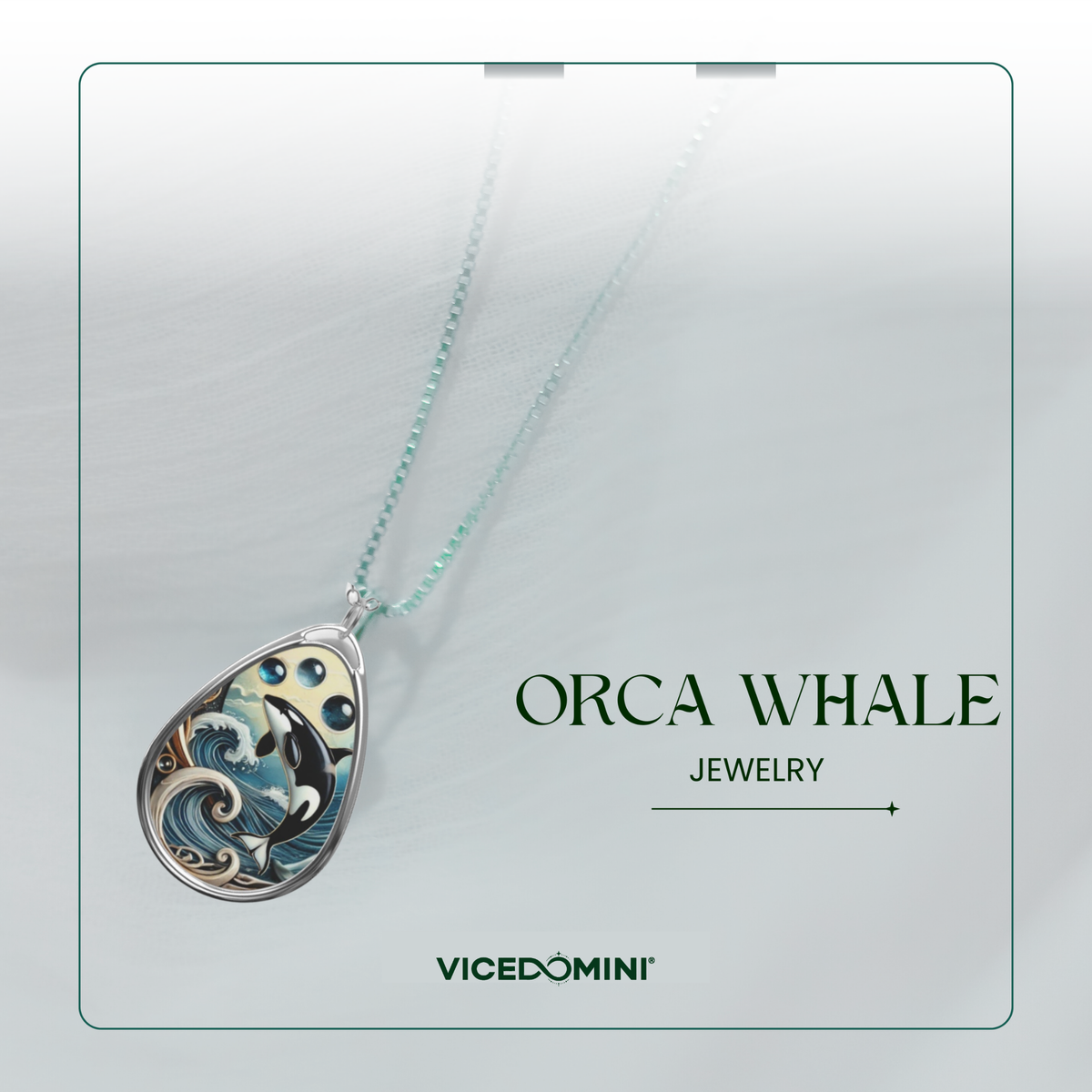 A Vicedomini 'Orca Whale' jewelry pendant necklace featuring a detailed whale design in blue, black, and white enamel on a silver-toned teardrop-shaped pendant, suspended from a light mint-green chain against a soft gray background with branding text.
