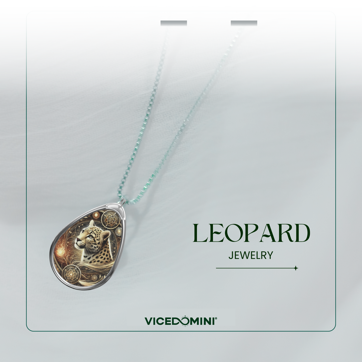 A teardrop-shaped leopard pendant necklace on a delicate mint green chain, presented on a white display card with the brand name Vicedomini and the collection name Leopard Jewelry.