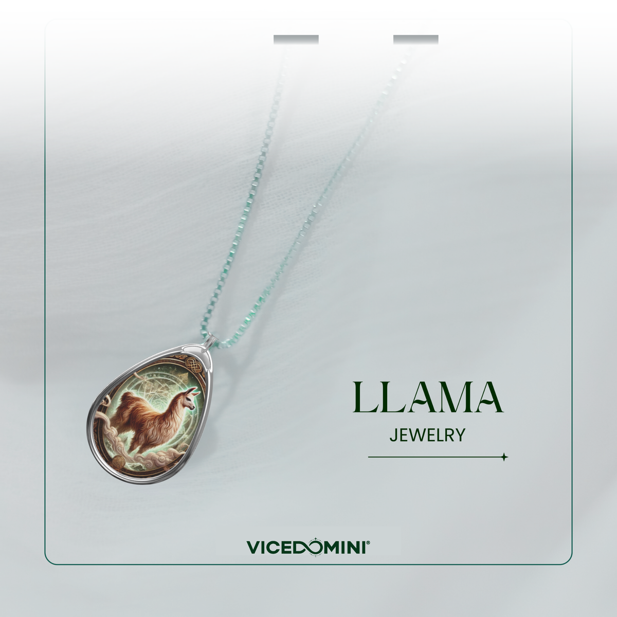 A Vicedomini Llama Jewelry pendant necklace featuring a detailed llama illustration in a silver teardrop frame on a light mint green chain, presented on a white display card.