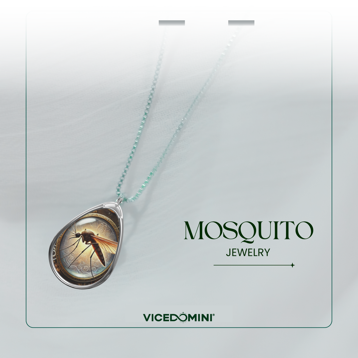 A Vicedomini Mosquito Jewelry necklace featuring a teardrop-shaped pendant with a detailed mosquito illustration under clear domed glass, suspended from a light aqua beaded chain on a white display card.