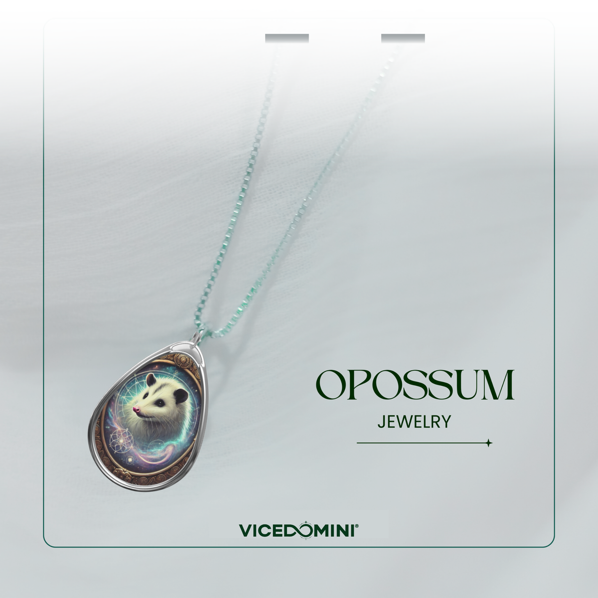 A teardrop-shaped pendant necklace featuring a detailed panda illustration with a light blue and purple cosmic background, suspended on a delicate mint green chain. The pendant is displayed on a white card with the text 'OPOSSUM JEWELRY' and the brand 'VICEDOMINI' printed below.
