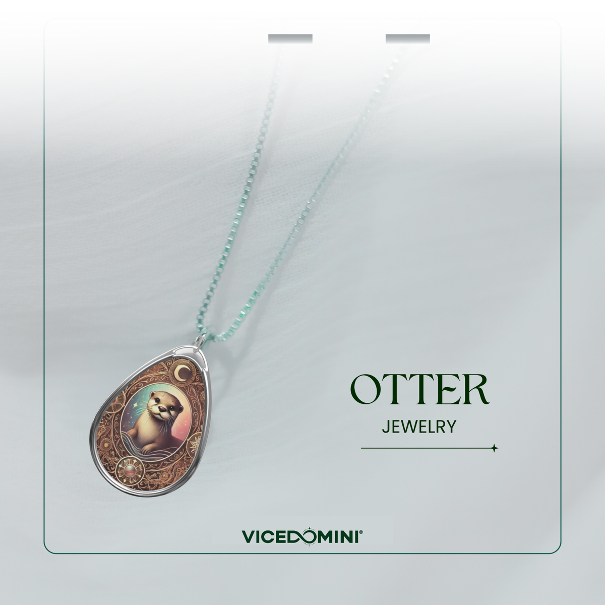 Teardrop-shaped pendant necklace featuring an otter portrait illustration, suspended on a delicate mint green chain against a soft white background with 'OTTER JEWELRY' and 'VICEDOMINI' branding.