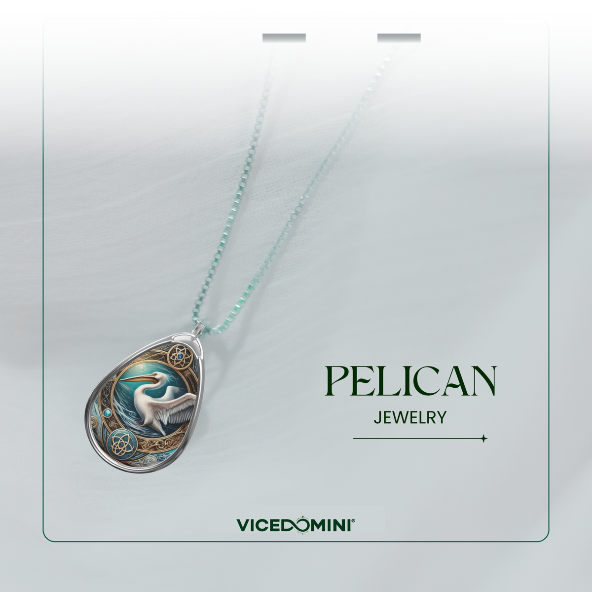 A Vicedomini jewelry necklace featuring a detailed teardrop pendant with an illustrated pelican in a silver frame, suspended from a delicate mint green chain. The product is displayed on a light gray card with the text 'PELICAN JEWELRY' and the Vicedomini brand name.