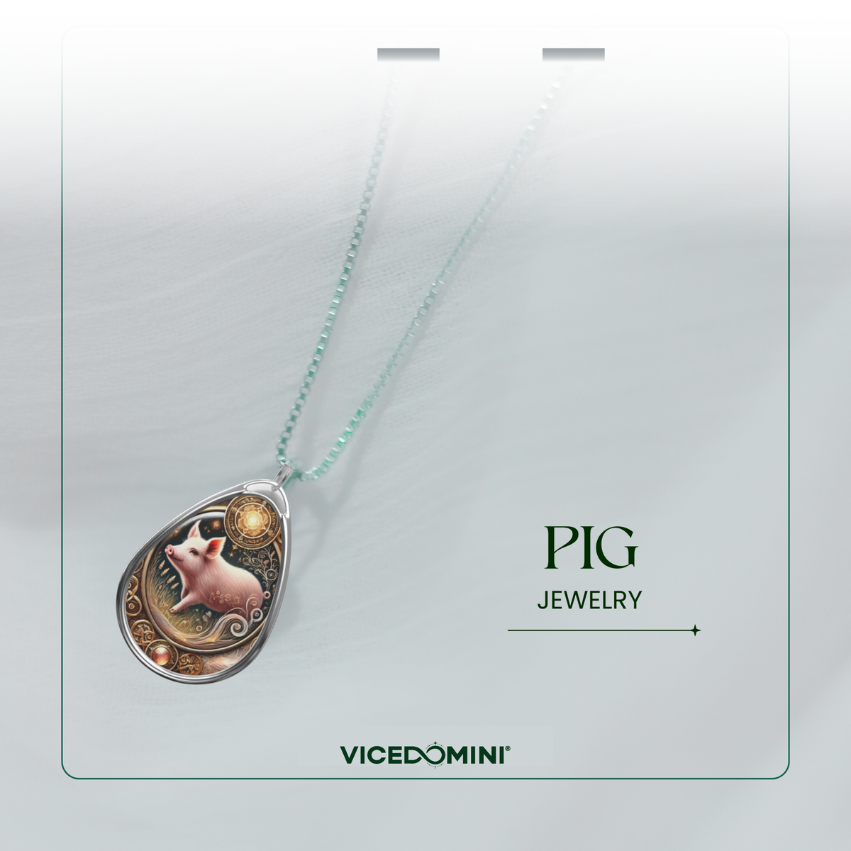 A teardrop-shaped pendant necklace on a delicate mint green chain, featuring a detailed illustration of a pig in a circular silver-toned frame. The necklace is presented on a light gray display card with the text 'PIG JEWELRY' and the brand 'VICEDOMINI' printed below.