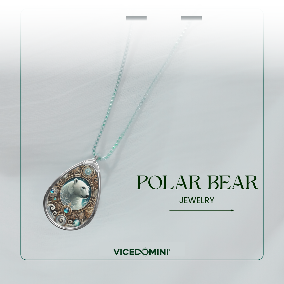 A teardrop-shaped pendant necklace on a matching chain, featuring a polar bear illustration surrounded by small blue and silver stones on a silver-toned frame. The necklace is displayed on a light gray card with the text 'POLAR BEAR JEWELRY' and the brand 'VICEDOMINI'.