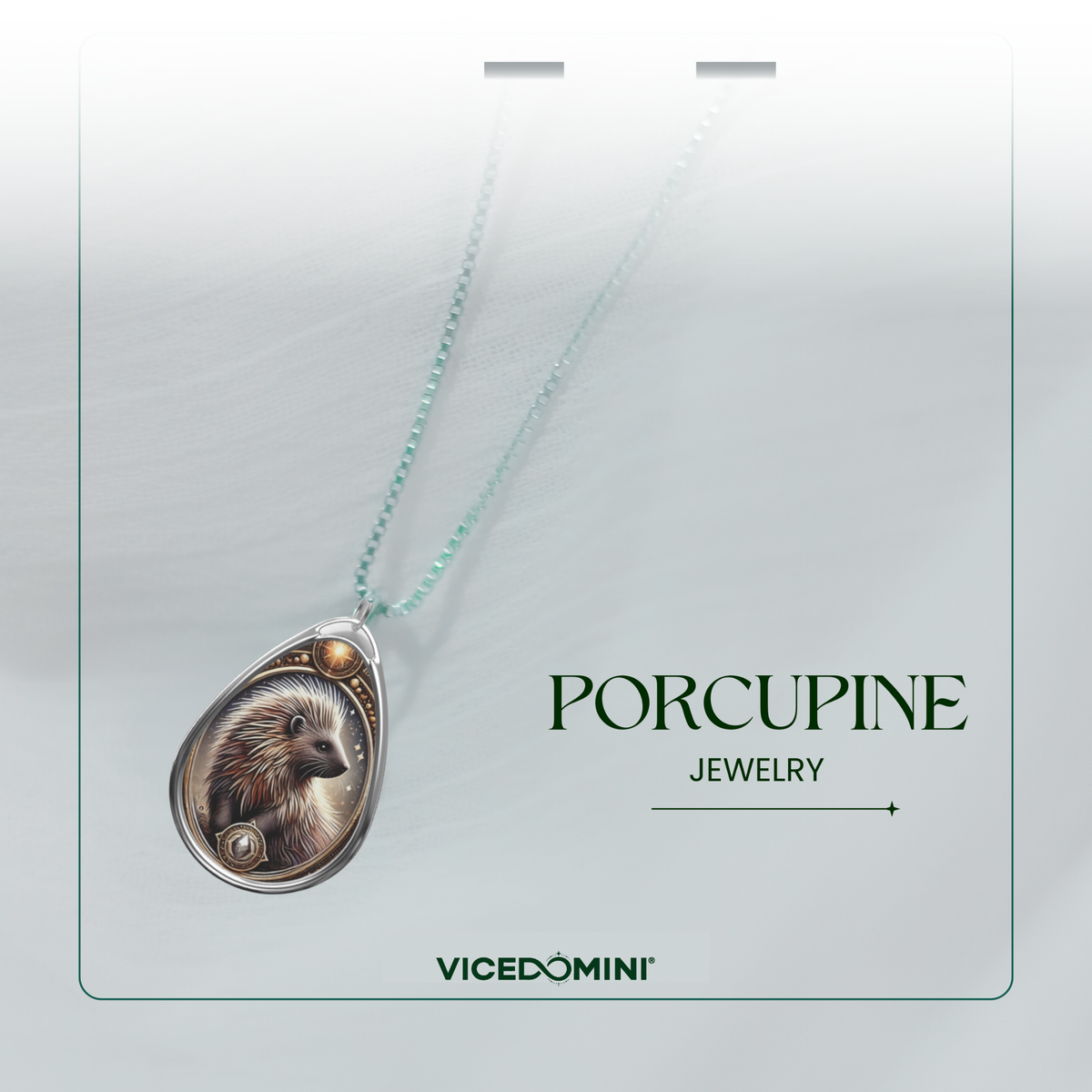 A teardrop-shaped pendant necklace featuring an illustrated porcupine, suspended from a delicate mint-green chain. The pendant is displayed on a light gray card with the text 'PORCUPINE JEWELRY' and the brand 'VICEDOMINI'.