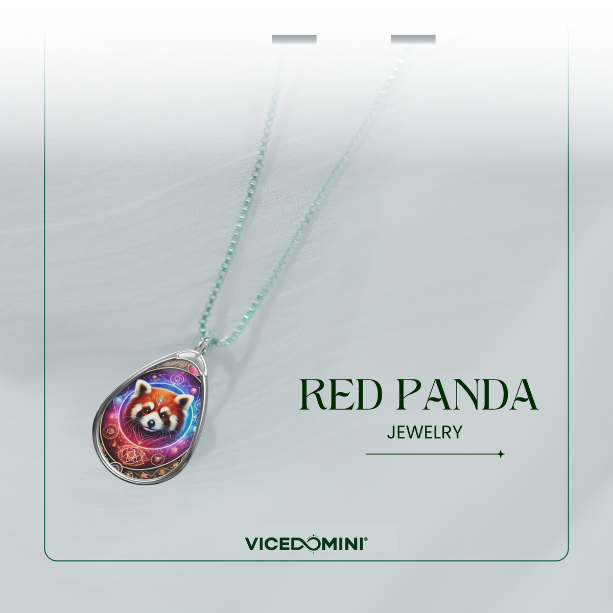 A delicate red panda pendant necklace with a cosmic-inspired design, suspended from a fine silver chain against a soft white fabric background. The words "RED PANDA JEWELRY" and "VICEDOMINI" are displayed in a clean, modern font.