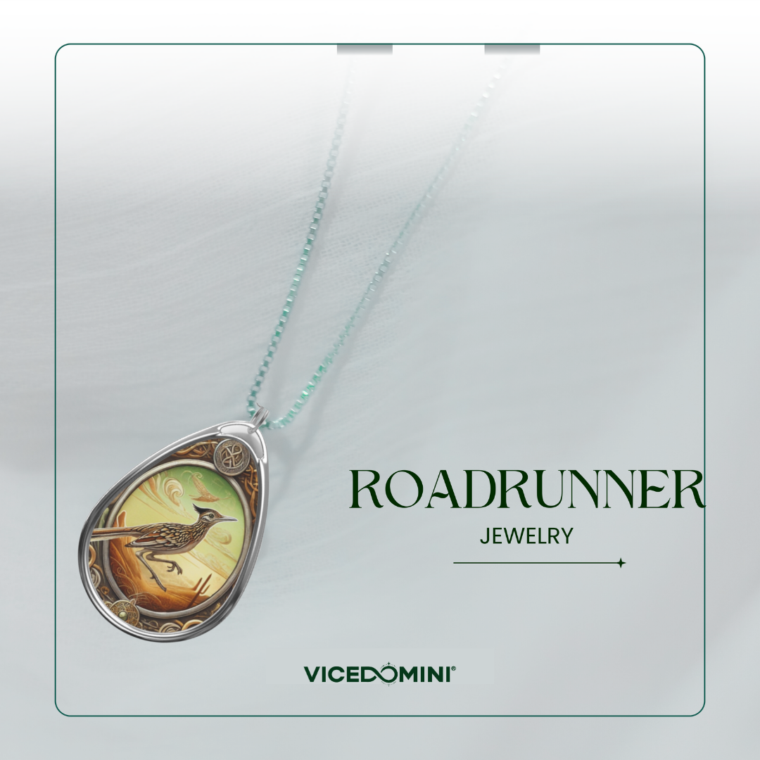 Teardrop-shaped pendant necklace with a bird illustration on a light mint chain, shown on a pale gray background with the text 'ROADRUNNER JEWELRY' and 'VICEDOMINI'.