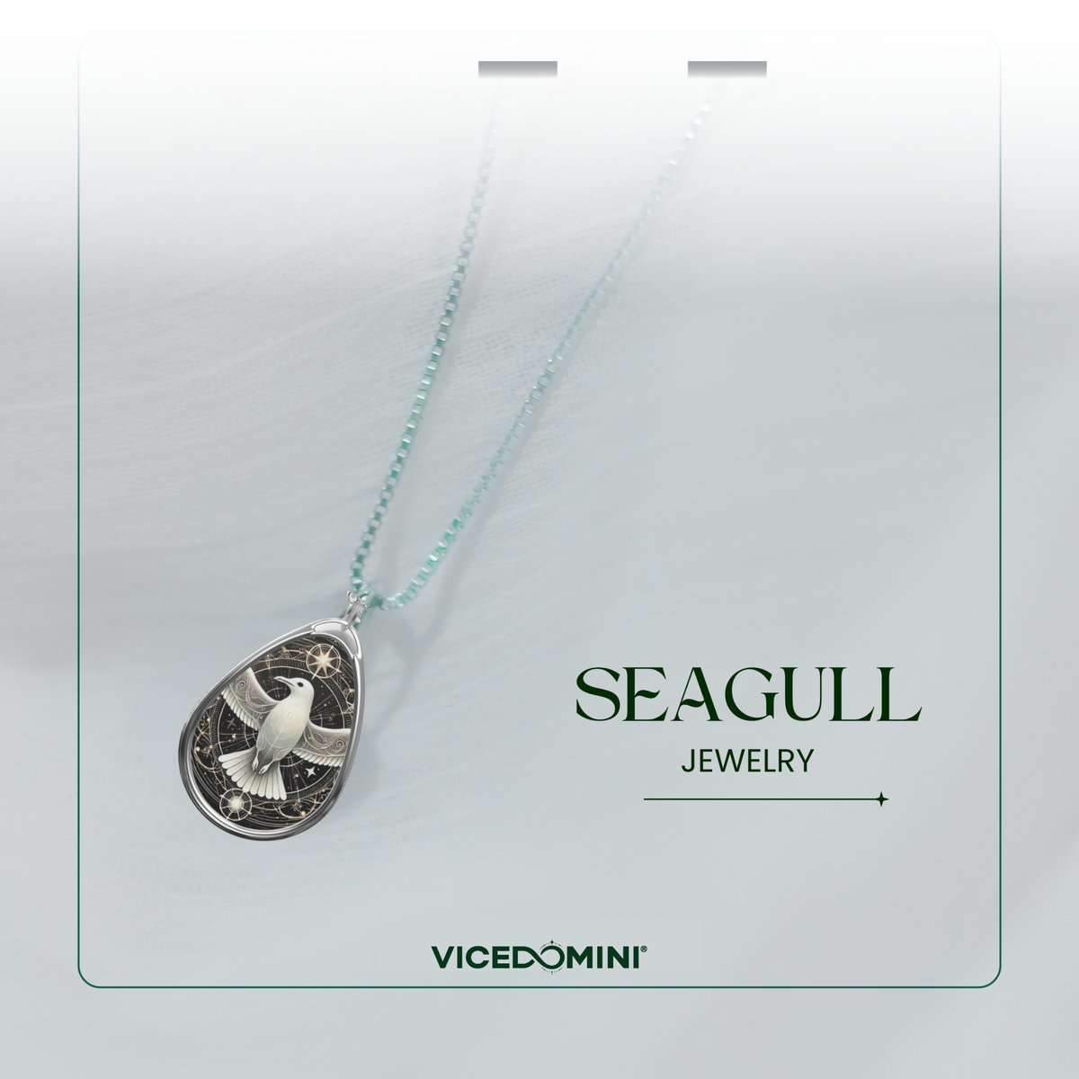 The Seagull Necklace is displayed on a delicate chain against a soft, blurred background. The pendant’s intricate design, featuring a luminous seagull against a dark, starry backdrop, is emphasized. The text "SEAGULL JEWELRY" and "VICEDOMINI" is included in the composition.