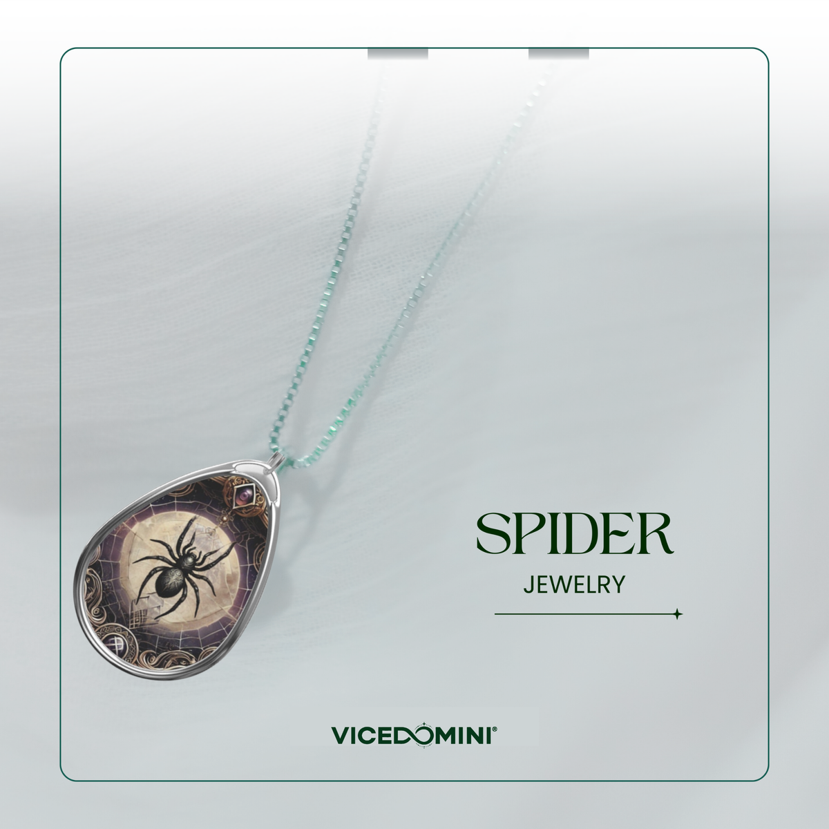A teardrop-shaped pendant necklace from Vicedomini Spider Jewelry, featuring a black spider illustration over a vintage-style brown and gold background, suspended on a light mint green chain against a soft gray background with a decorative border.
