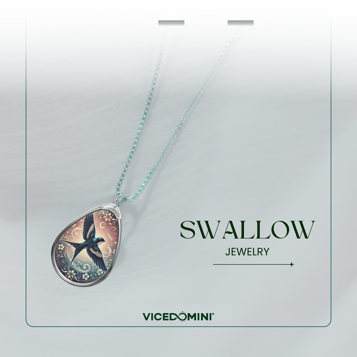 A Vicedomini jewelry necklace featuring a silver teardrop pendant with a detailed swallow illustration and a light mint green chain, presented on a white display card with the text 'SWALLOW JEWELRY' and 'VICEDOMINI'.