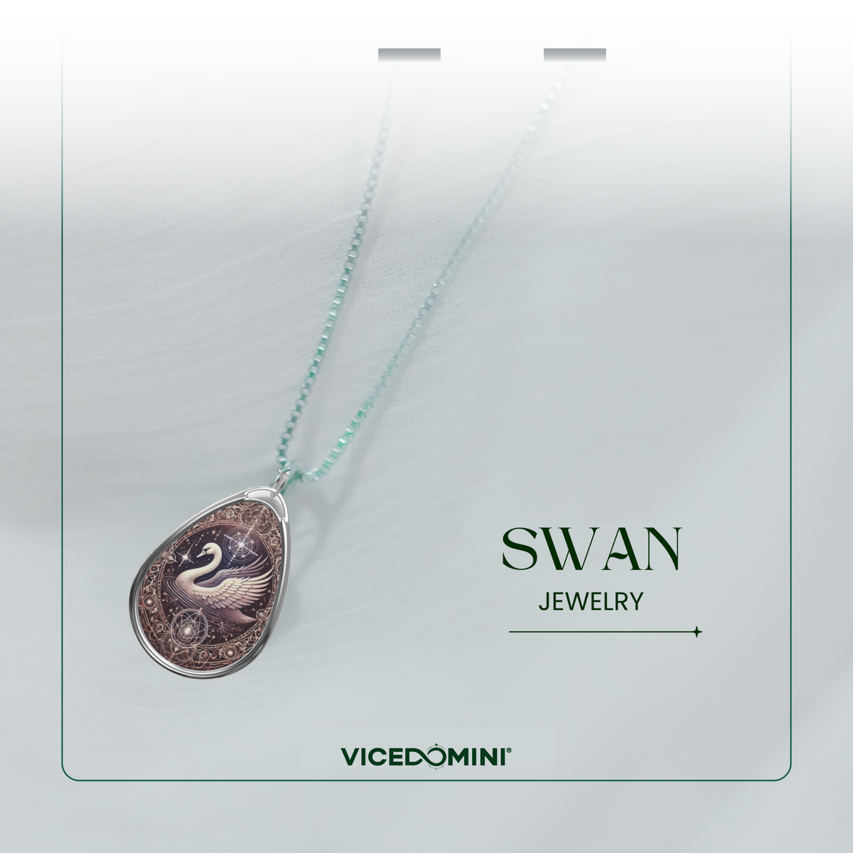 A teardrop-shaped pendant necklace with a swan illustration, hanging from a delicate mint green chain on a white display card. The card features the text 'SWAN JEWELRY' and the brand 'VICEDOMINI'.