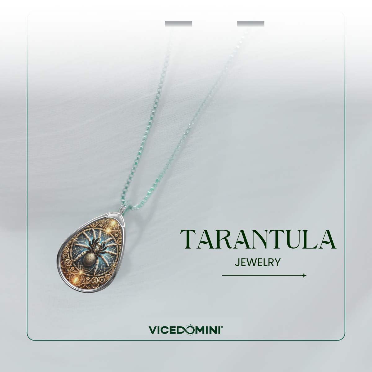 A teardrop-shaped tarantula pendant necklace on a delicate mint green chain, displayed on a white jewelry card with the text 'TARANTULA JEWELRY' and the brand 'VICEDOMINI'.