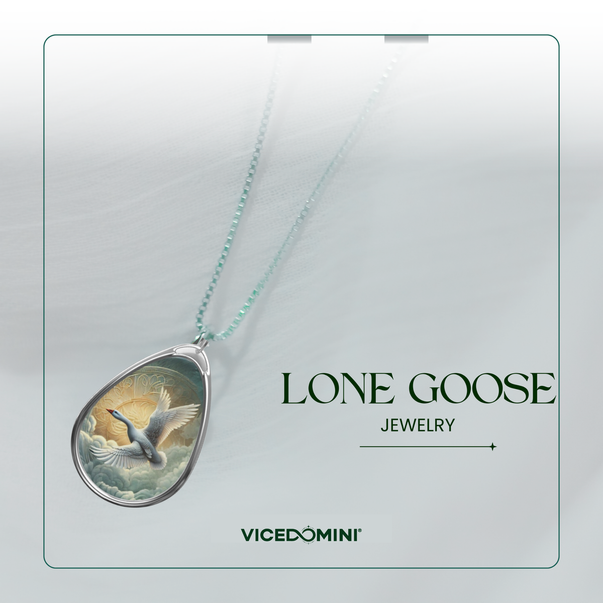 A teardrop-shaped pendant necklace with a silver-toned frame and a detailed illustration of a goose in flight, hanging from a delicate mint-green chain. The pendant is displayed on a light gray textured background with a thin green border, alongside the text 'LONE GOOSE JEWELRY' and the brand 'VICEDOMINI'.