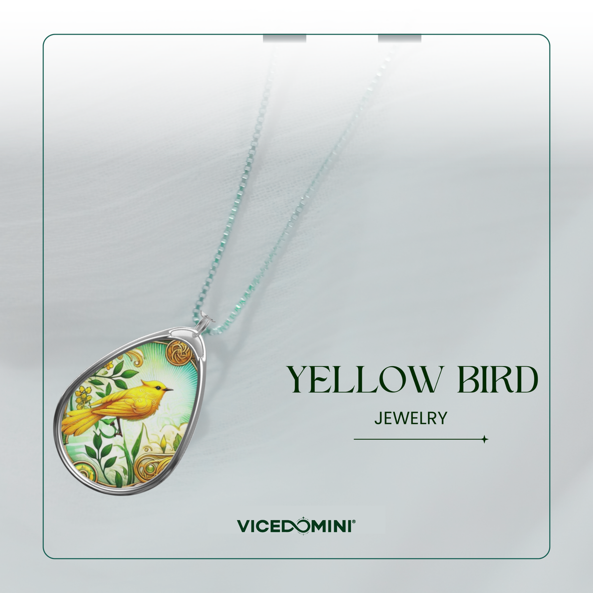 A teardrop-shaped pendant necklace featuring a yellow bird illustration on a light green background, suspended from a delicate mint-green chain. The pendant is displayed on a clean, light gray card with the text 'YELLOW BIRD JEWELRY' and the brand 'VICEDOMINI'.