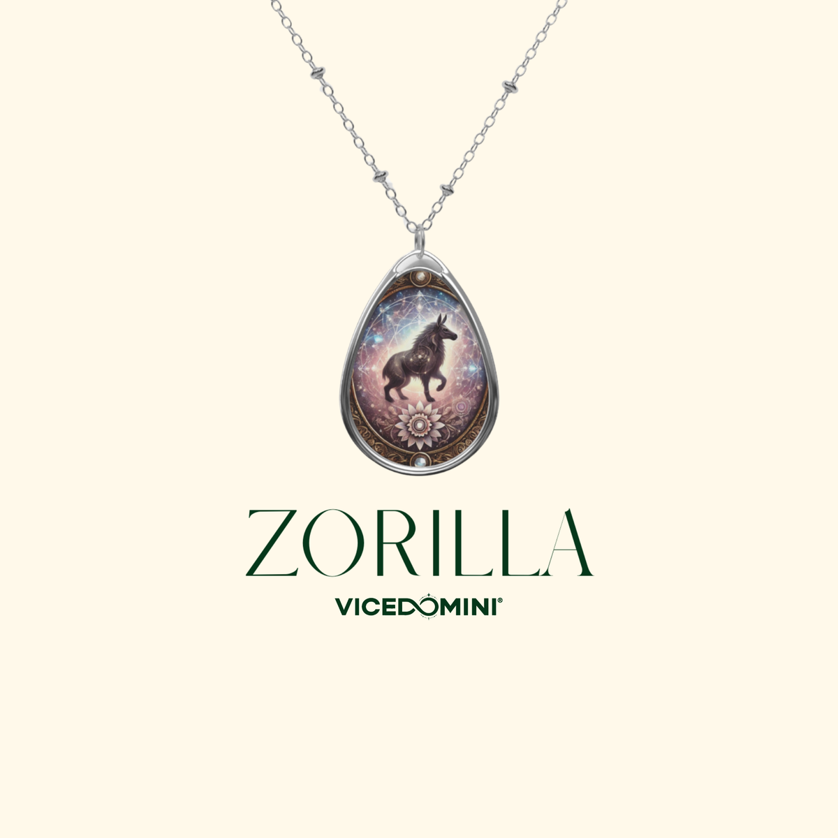 A teardrop-shaped pendant necklace featuring a dark zebra on a purple and blue cosmic background, suspended from a silver chain. The brand name 'ZORILLA' and sub-brand 'VICEDOMINI' are printed in dark green below the pendant on a solid pale cream background.