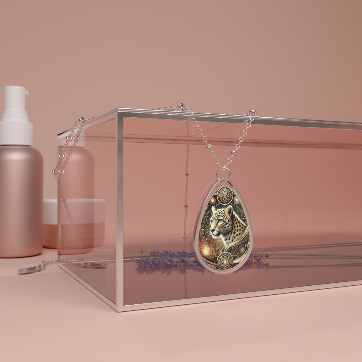 The leopard pendant necklace elegantly draped over a transparent display box, with soft pink beauty bottles and dried lavender in the background. The pendant showcases a majestic leopard surrounded by celestial motifs, set within a silver teardrop frame. The composition is luxurious and sophisticated.