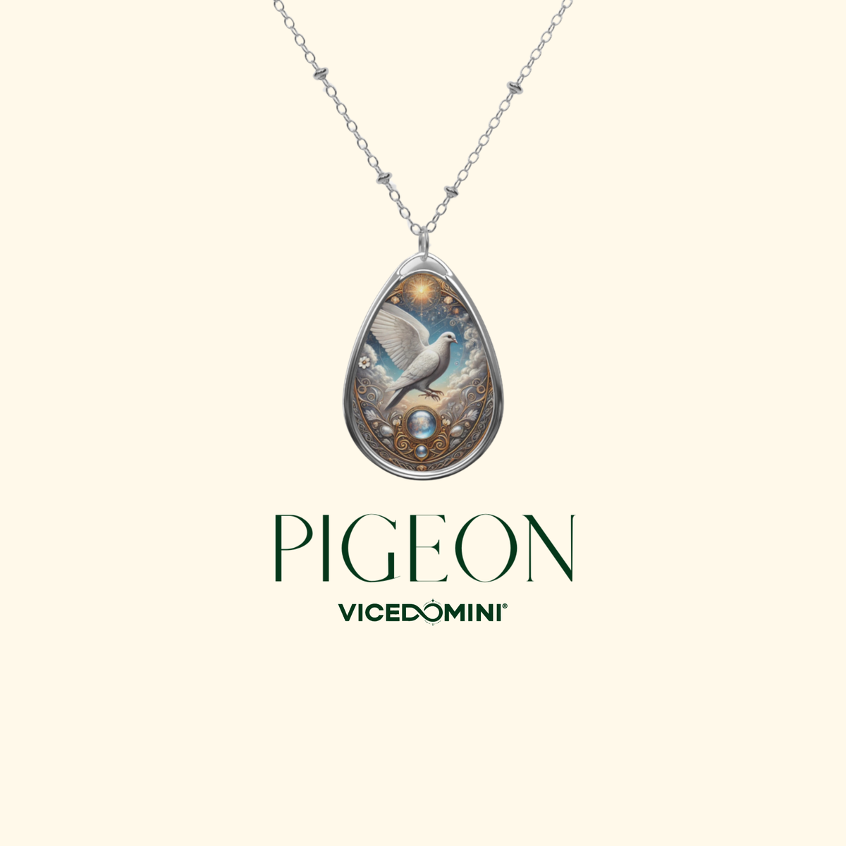 A silver teardrop pendant necklace featuring a detailed illustration of a white dove with a blue and gold background, suspended from a delicate silver chain. The brand name 'PIGEON VICEDOMINI' is displayed below the pendant on a solid pale cream background.