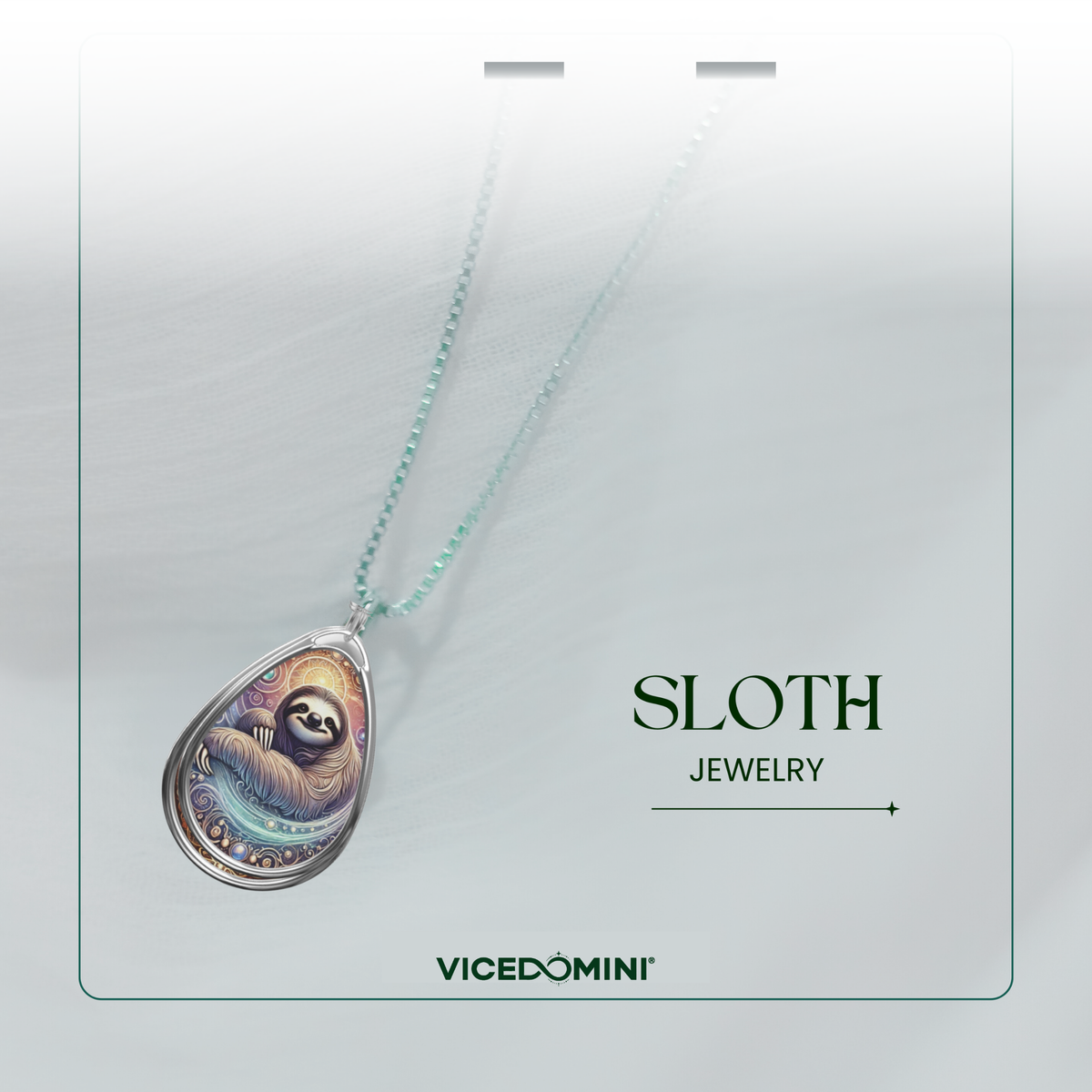 A teardrop-shaped pendant necklace featuring a colorful sloth illustration, suspended from a light mint-green chain. The necklace is presented on a white display card with the text 'SLOTH JEWELRY' and the brand 'VICEDOMINI' printed below.
